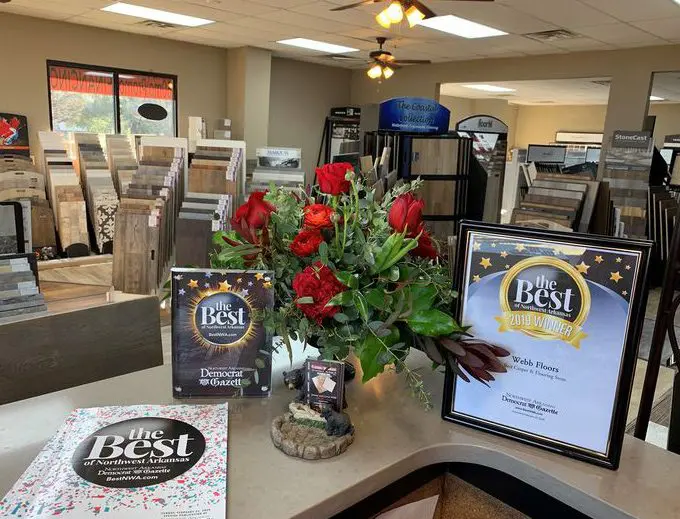 A table with flowers and awards on it